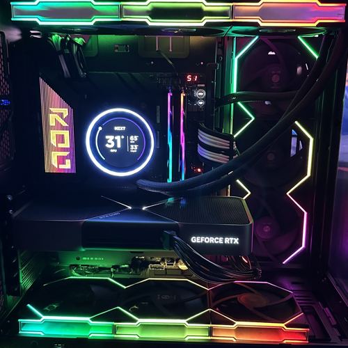 Black gaming PC with ROG cooler screen and rainbow RGB GeForce RTX graphics card