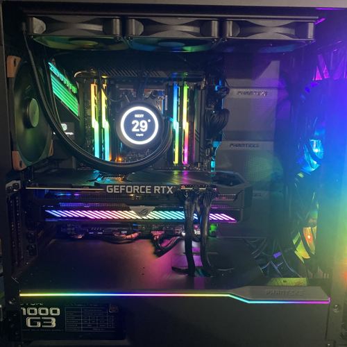 Dark custom PC with GeForce RTX card and liquid cooler display