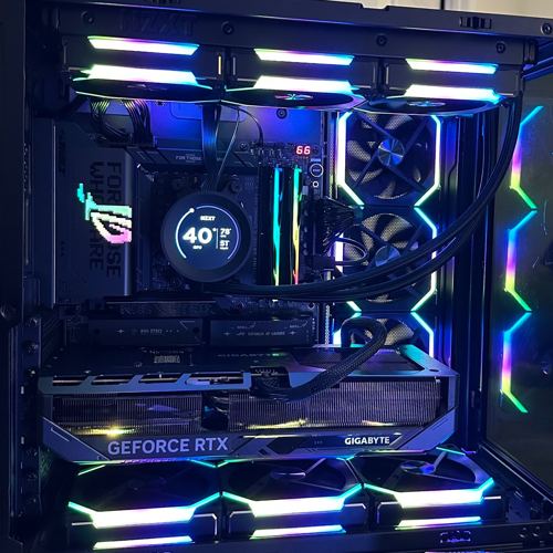 Black dual-chamber gaming PC with ROG cooler screen and Gigabyte RTX card